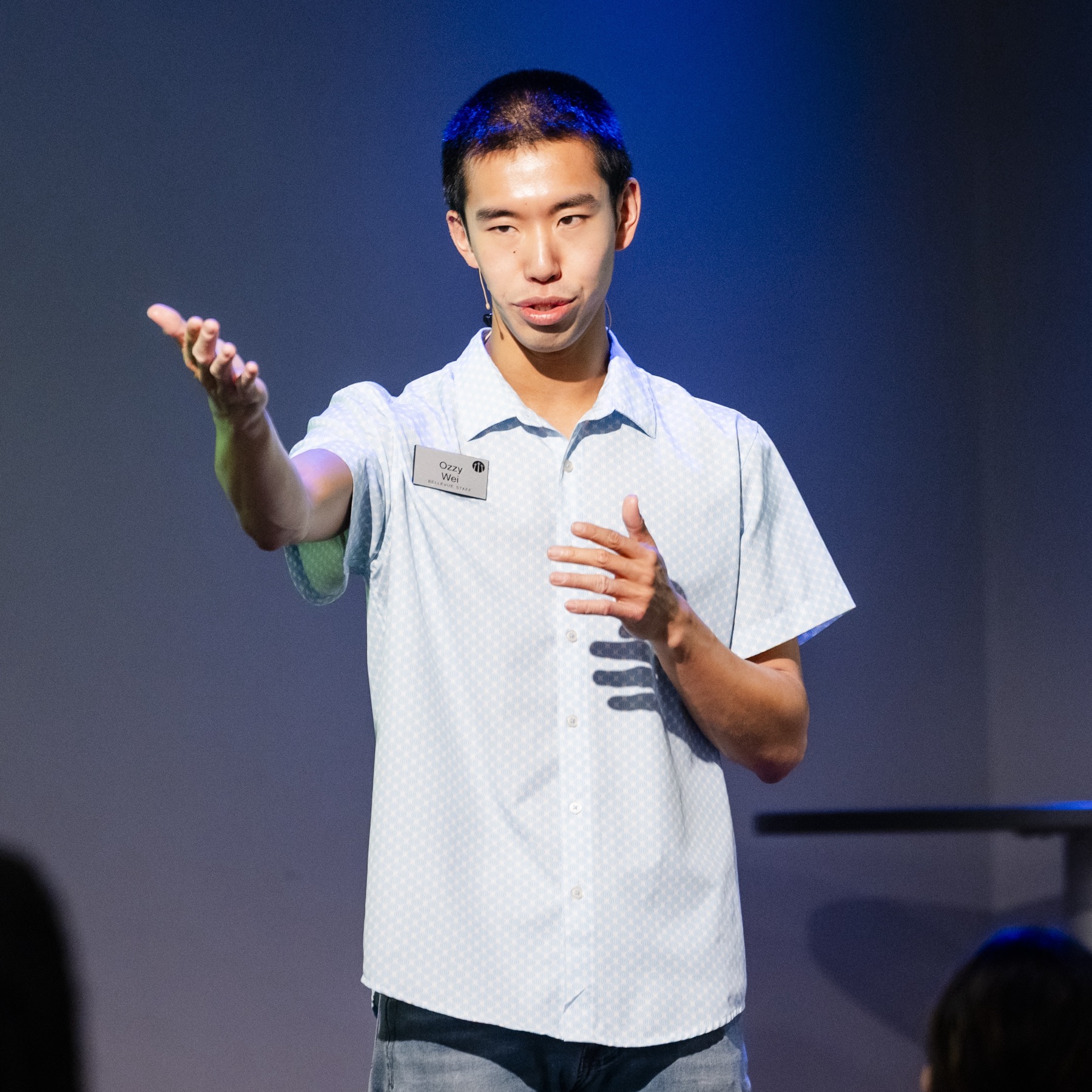 Ozzy Wei teaching during an Adult Singles gathering